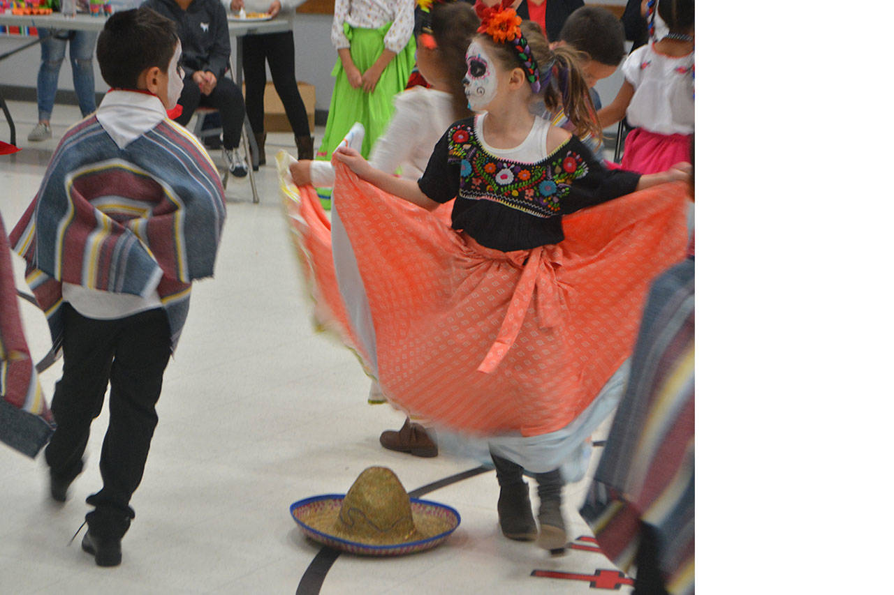 First-grader Penny Perillo twirls her dress during the Mexican Hat Dance.