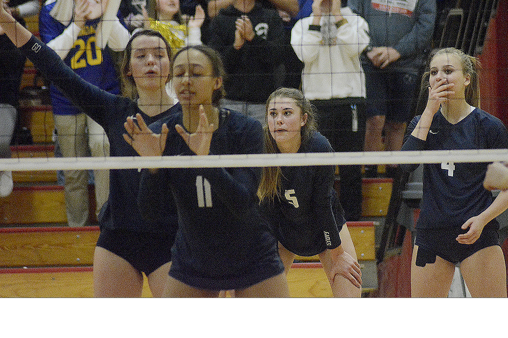 Arlington Eagles show a range of emotions in a recent volleyball game. From left, Arianna Bilby, Teagan Sutherland, Emily Mekelburg and Taylor Pederson.
