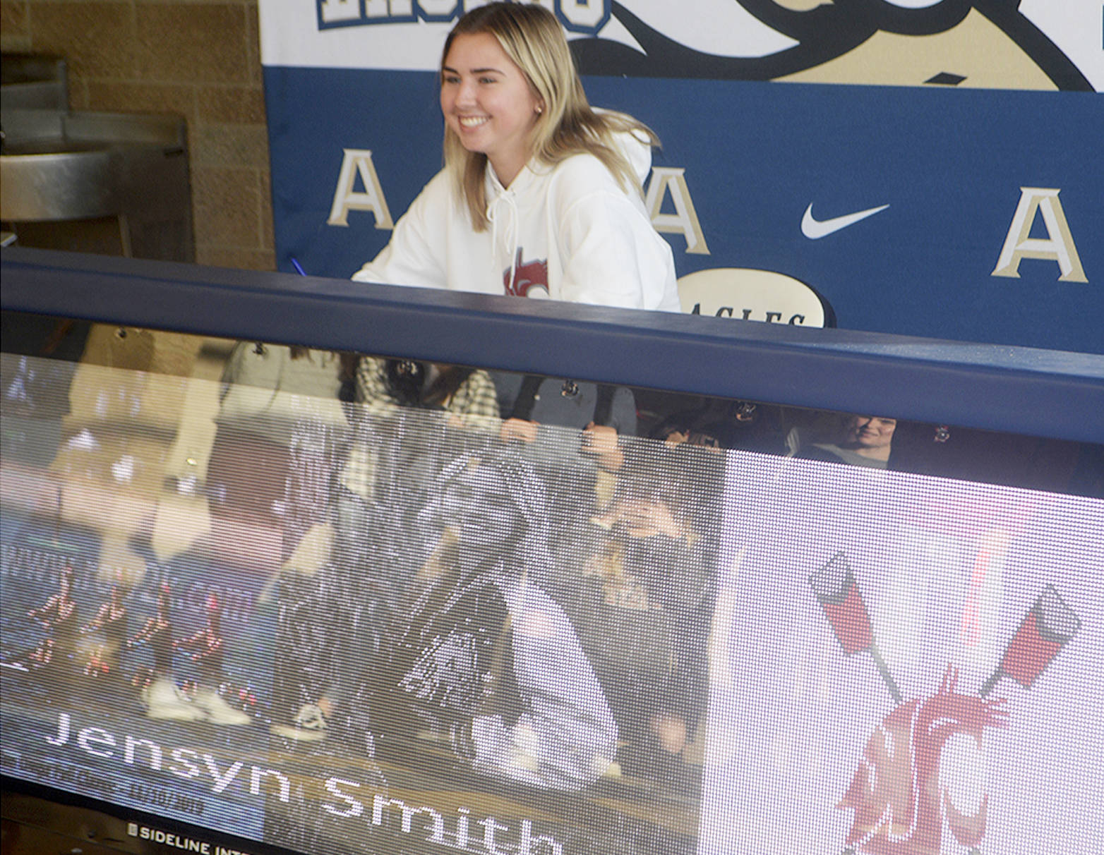 Jensyn Smith of Arlington signs a letter of intent to become a member of the rowing team at WSU. (Steve Powell/Staff Photo)