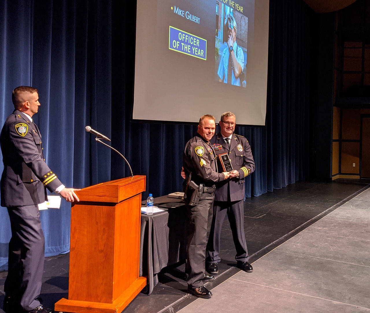 Arlington Police Chief Jonathan Ventura presents Sgt. Mike Gilbert with the Office of the Year Award at a ceremony Jan. 24 in the Byrnes Performing Arts Center. It was one of awards bestowed on officers, support staff and volunteers.