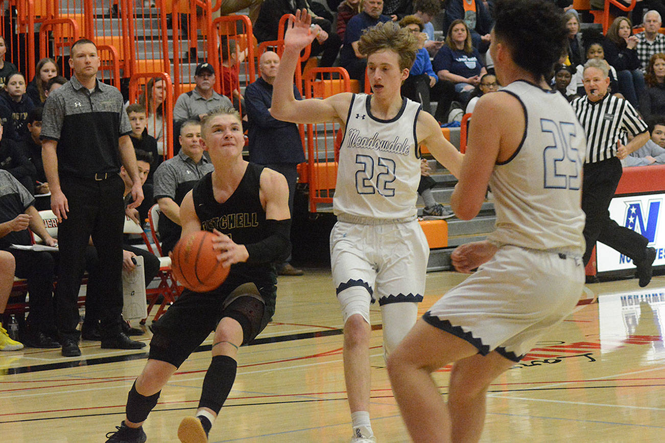Josiah Koellmer comes to a jump stop to get ready to shoot against Meadowdale.