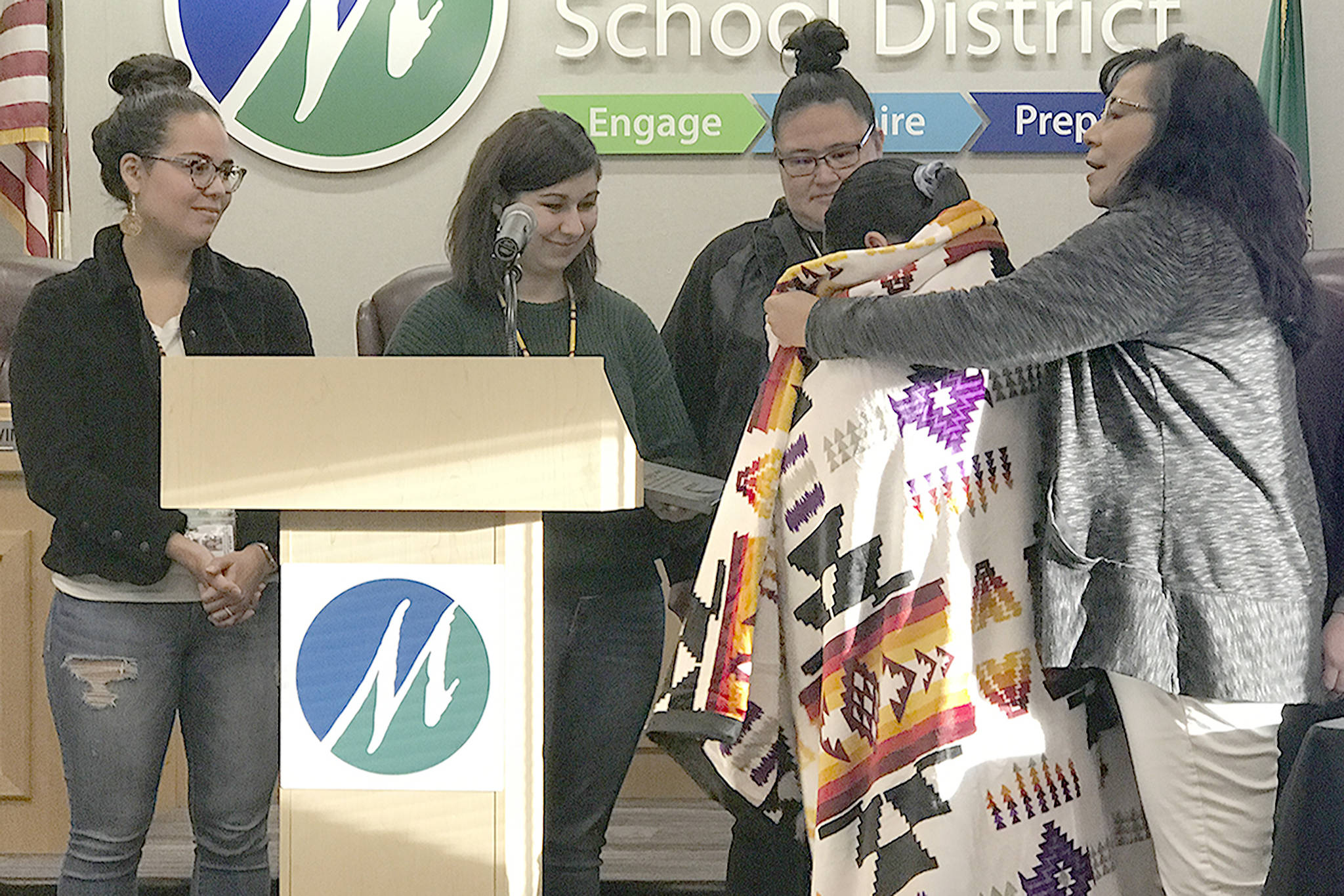 Maleia Kicking Woman receives a blanket from tribal members Tuesday. (Courtesy Photo)