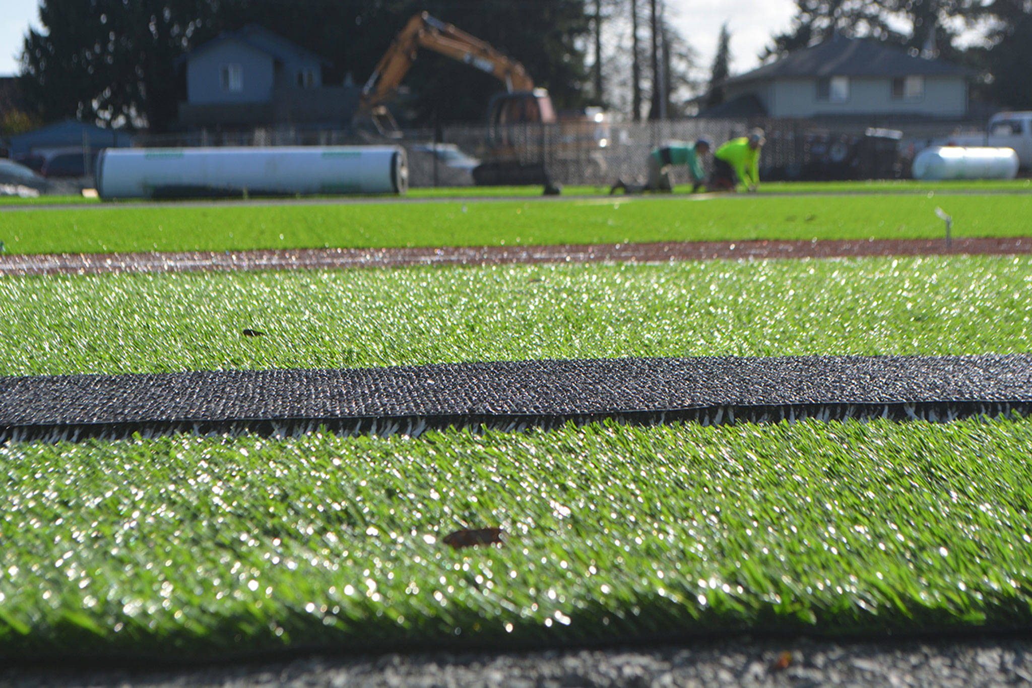Brown turf is in the base lines, surrounded by the green turf of the field. (Steve Powell/Staff Photos)