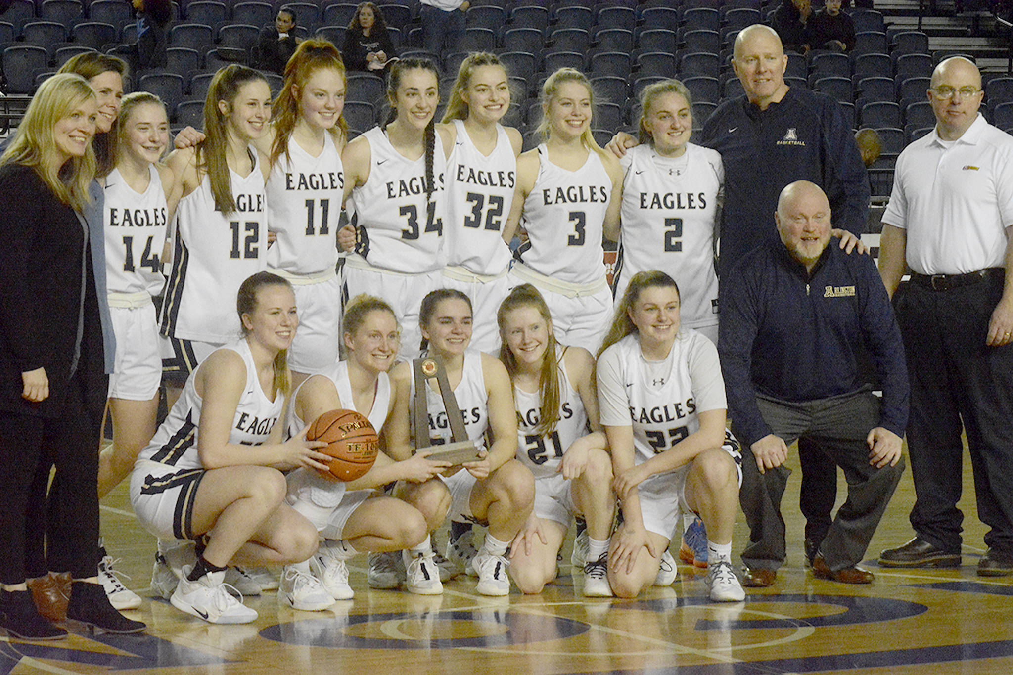 The Arlington girls basketball team poses for a picture.