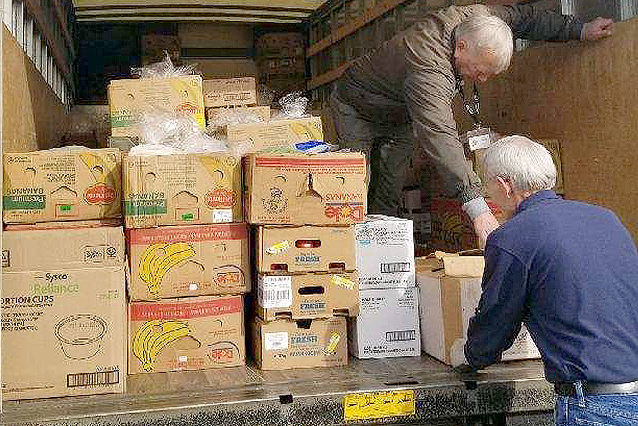 Marysville Food Bank volunteers unload donated items from the Tulalip Tribes. (Courtesy Photo)