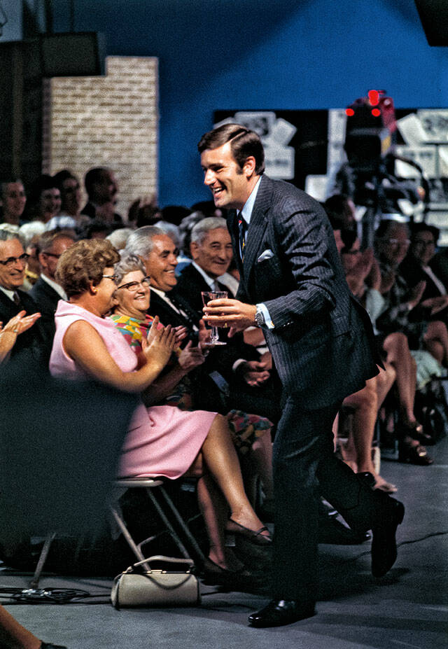Graham Kerr dashes by “The Galloping Gourmet” audience on the show that made him an international star in the late 1960s. (Bob Peterson / Rizzoli New York)